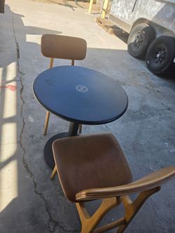 Round Black Bistro Table with Two Wood Chairs