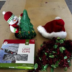 Christmas Items: Christmas hat, Christmas card holder, Christmas light clips