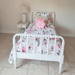 White wood twin bed and night table