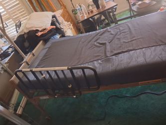 Working Electric bed with grab bar
