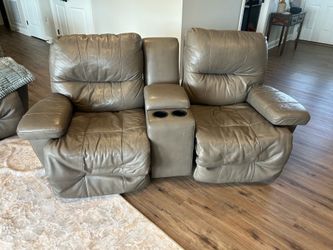 Gray matching power reclining sofa and console rocking loveseat.