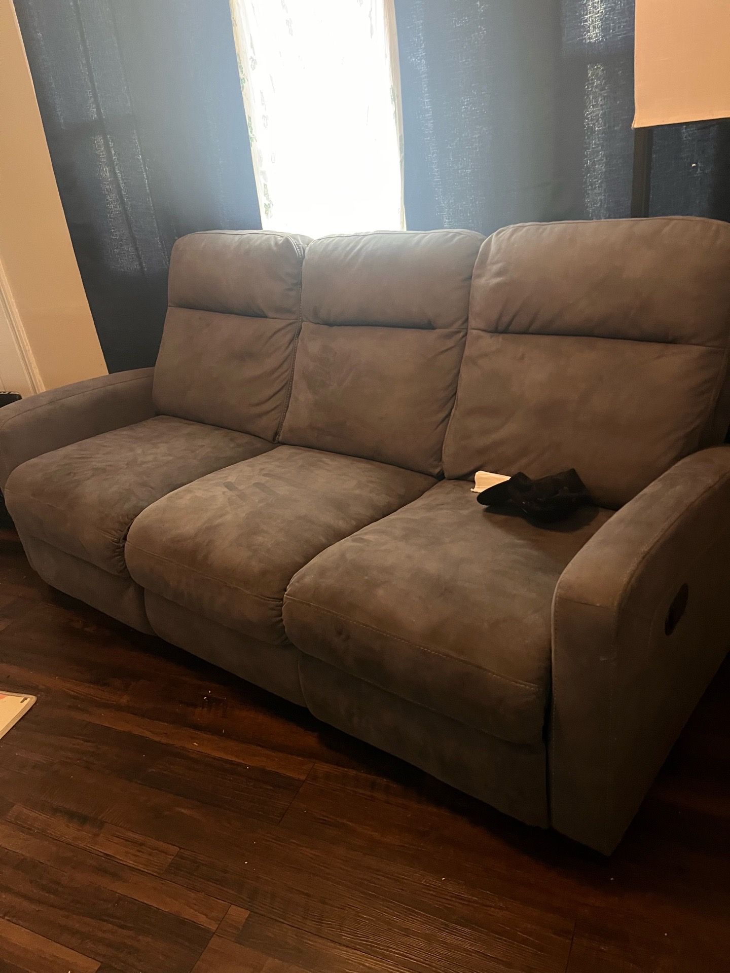 Two separate sectional couches both recline