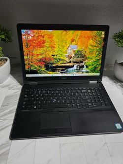 Black Dell Latitude E5570 15-inch laptop with full keyboard including numpad, trackpoint, and Windows 11 Pro loaded and running. i5 CORE PROCESSOR 6th