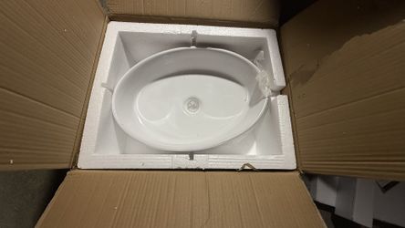 new white oval ceramic vessel sink