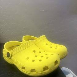 Bright yellow Crocs