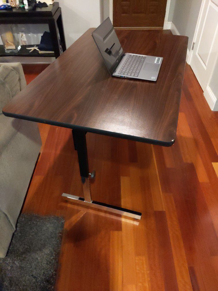 Adjustable Height Desk.  33"Tall X 48" Wide X 30" Deep