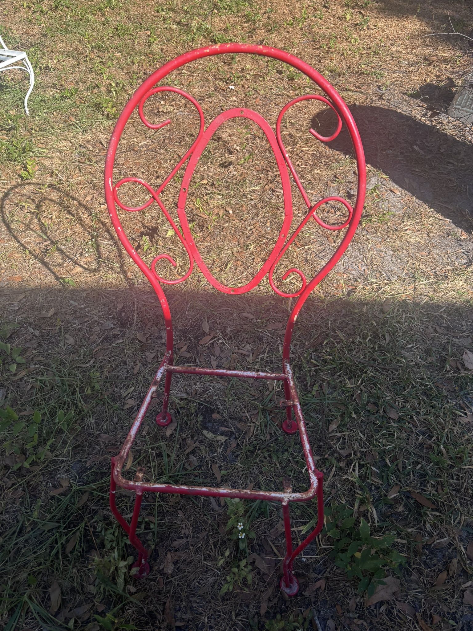 Two Red Metal Chairs