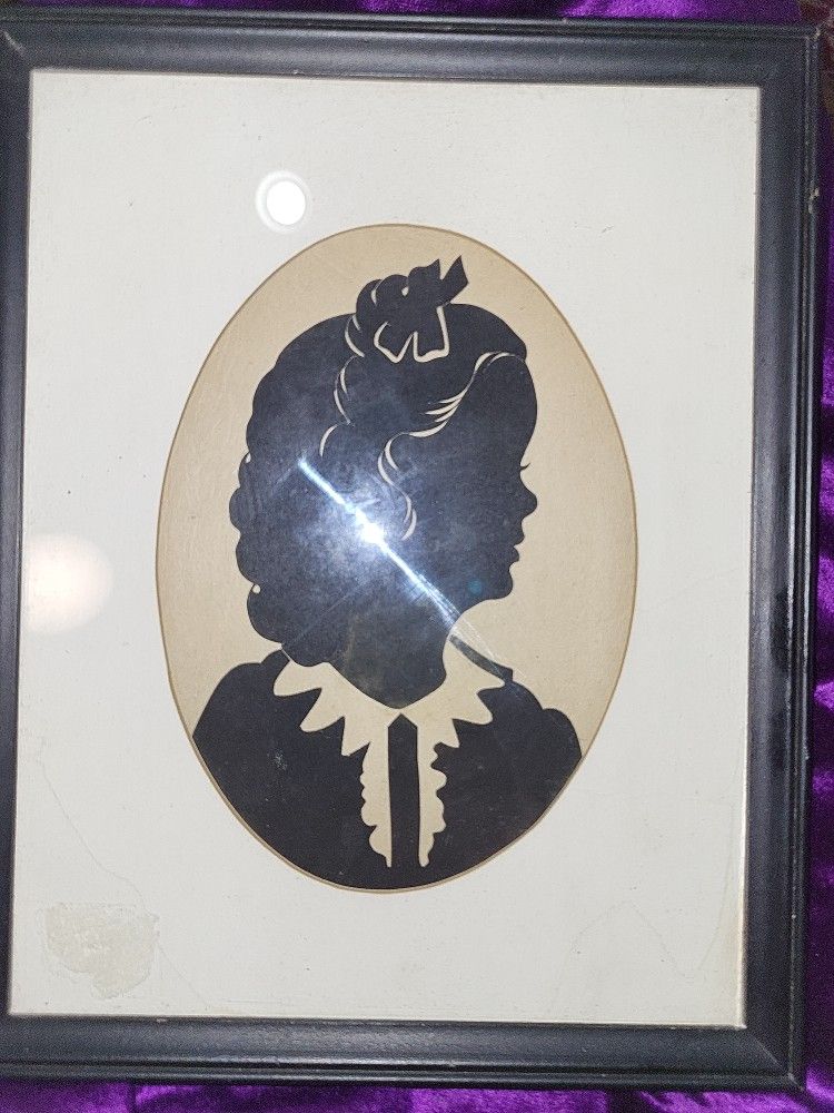 Silhouette Of Young Girl.