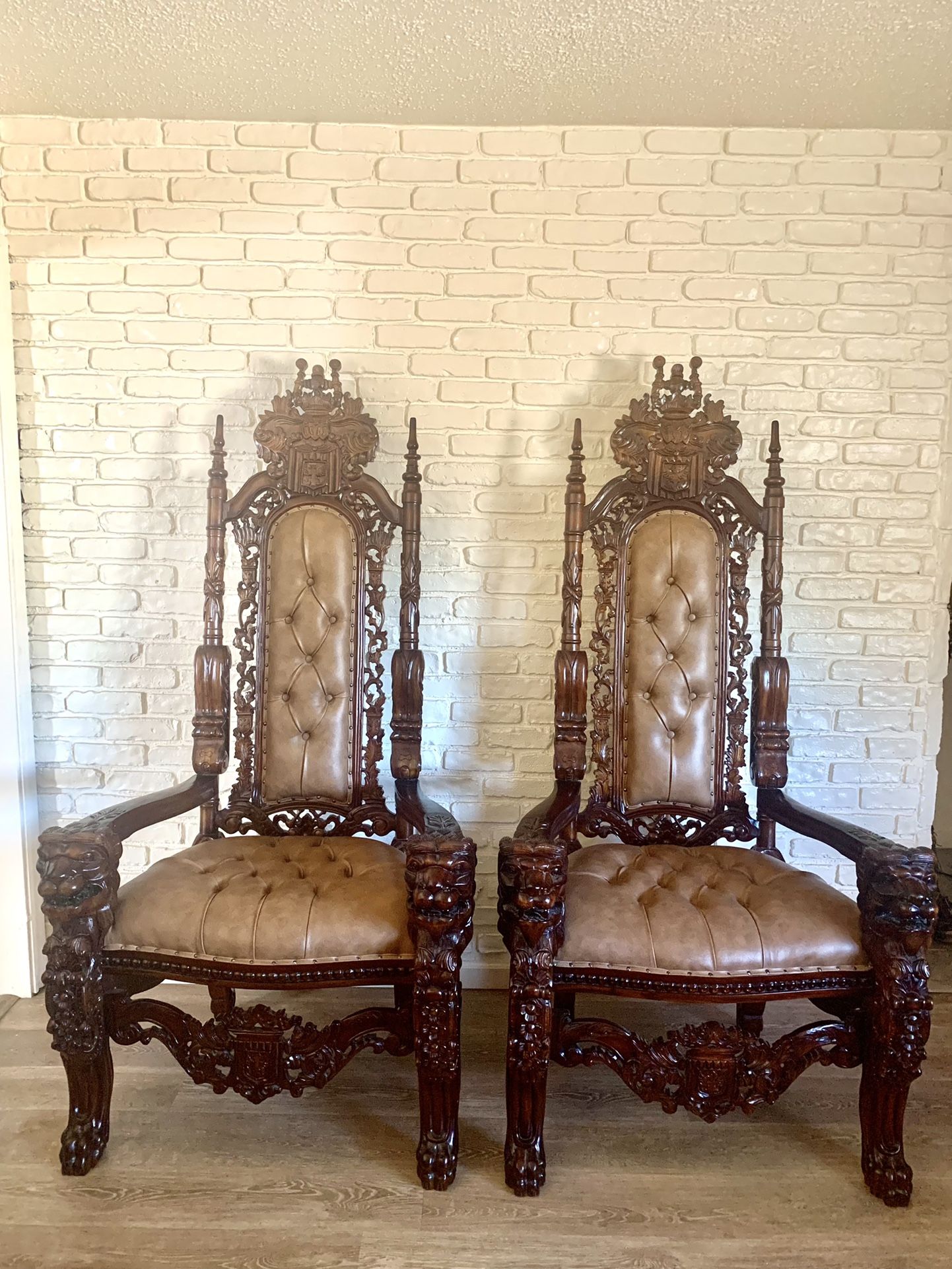 Gorgeous pair of Gothic, Italian Renaissance Style Throne Chairs in dark mahogany wood with beige leather seats and backrests. Nailhead trim. Amazing