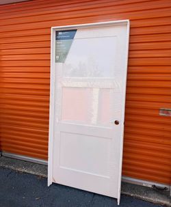 MMI DOOR 36-in x 80-in Primed Solid core 3-panel Left hand Smooth Primed MDF Flat Jamb Single Prehung Interior