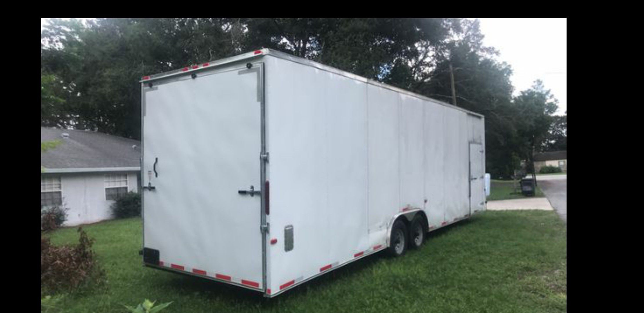 Cargo trailer 30ft / dual axles / extra height and many add ons .