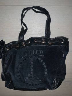 a black velour Juicy Couture Daydreamer tote bag featuring a stitched peace sign logo