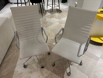 Two white office chair chairs