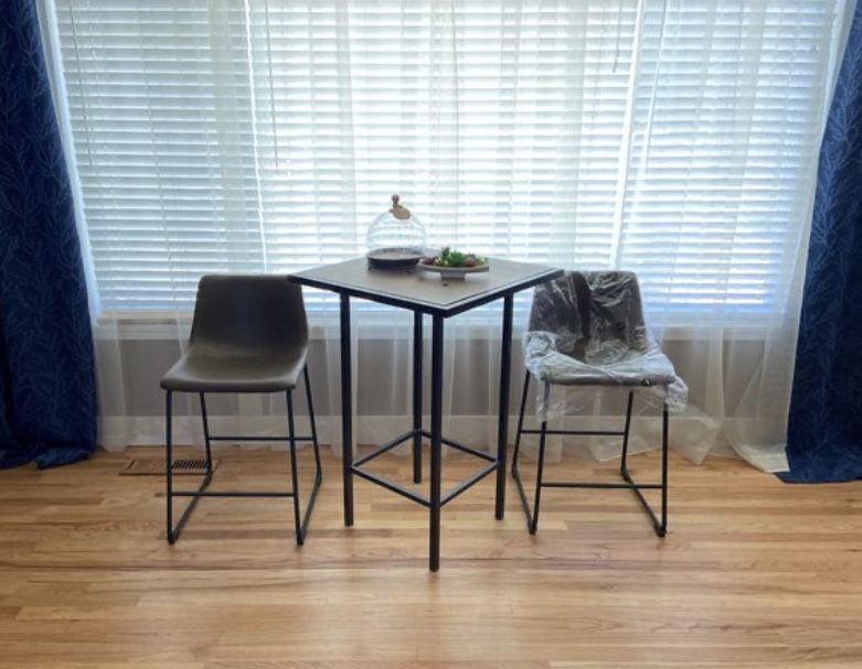 Wooden table and leather chairs