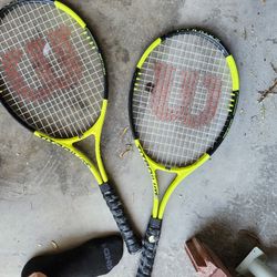 Tennis Rackets And Couple Softball Bats