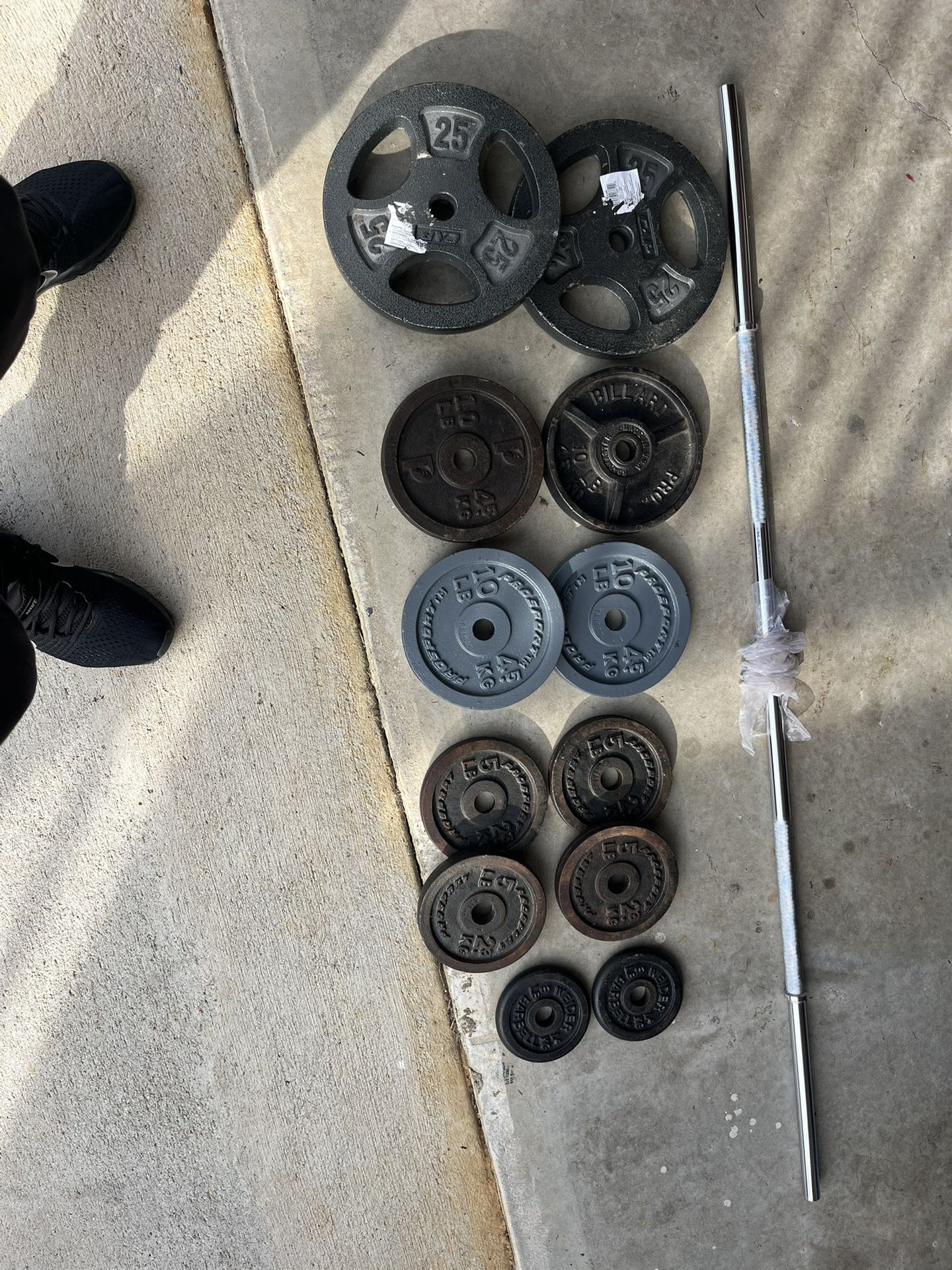 130 pound standard 1” weight set . includes brand new barbell