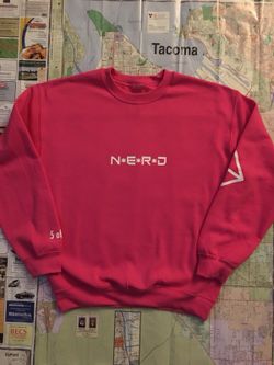 Hot pink Pharrell “NERD” crewneck BBC BAPE