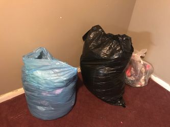 Garbage bags full of women’s clothes
