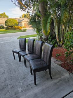 4 black alligator skin chairs REAL