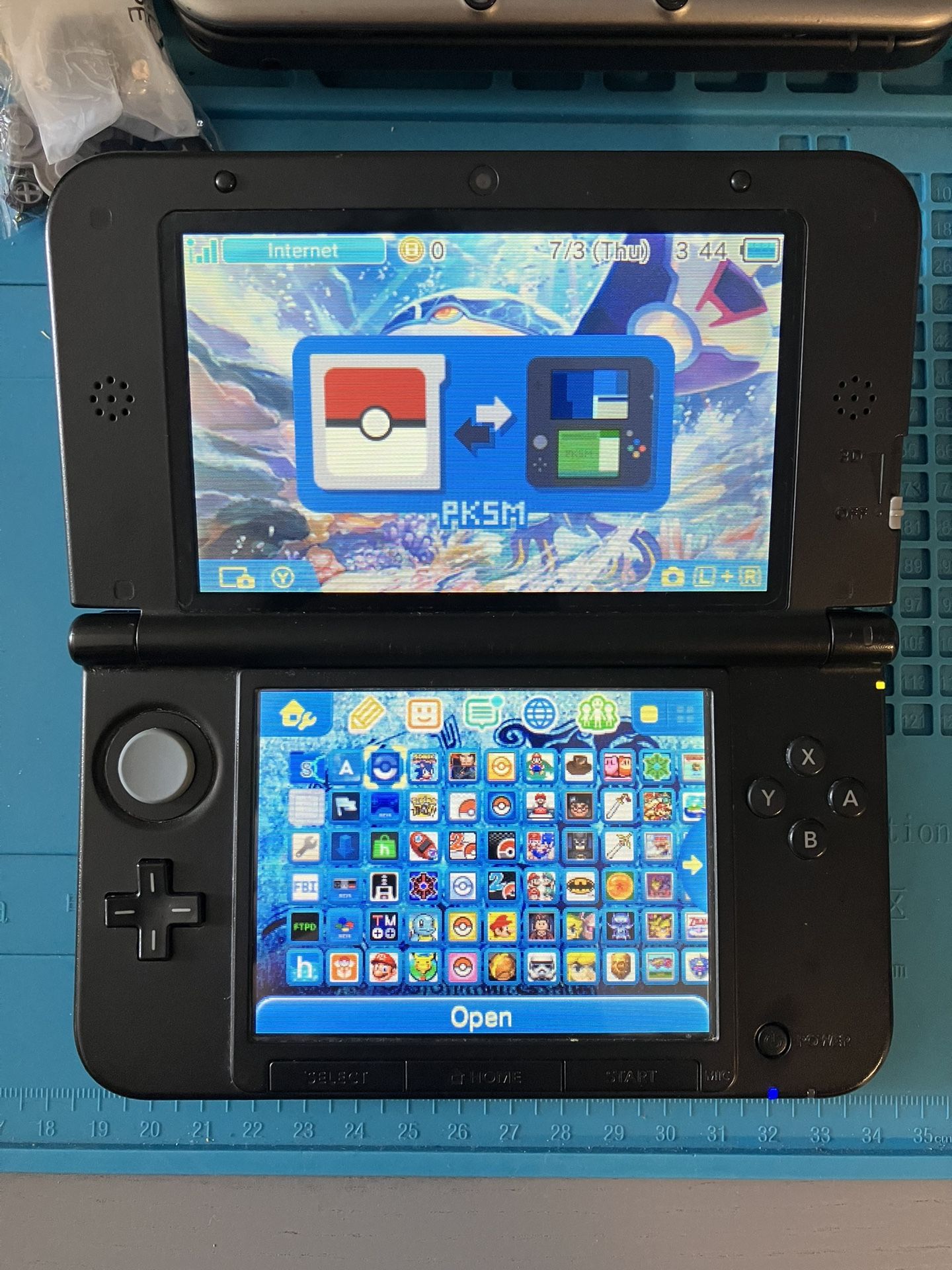 Nintendo Blue 3DS XL With Pokemon Bank, Pokemon DS, Stylus, 64 GB SD Card
