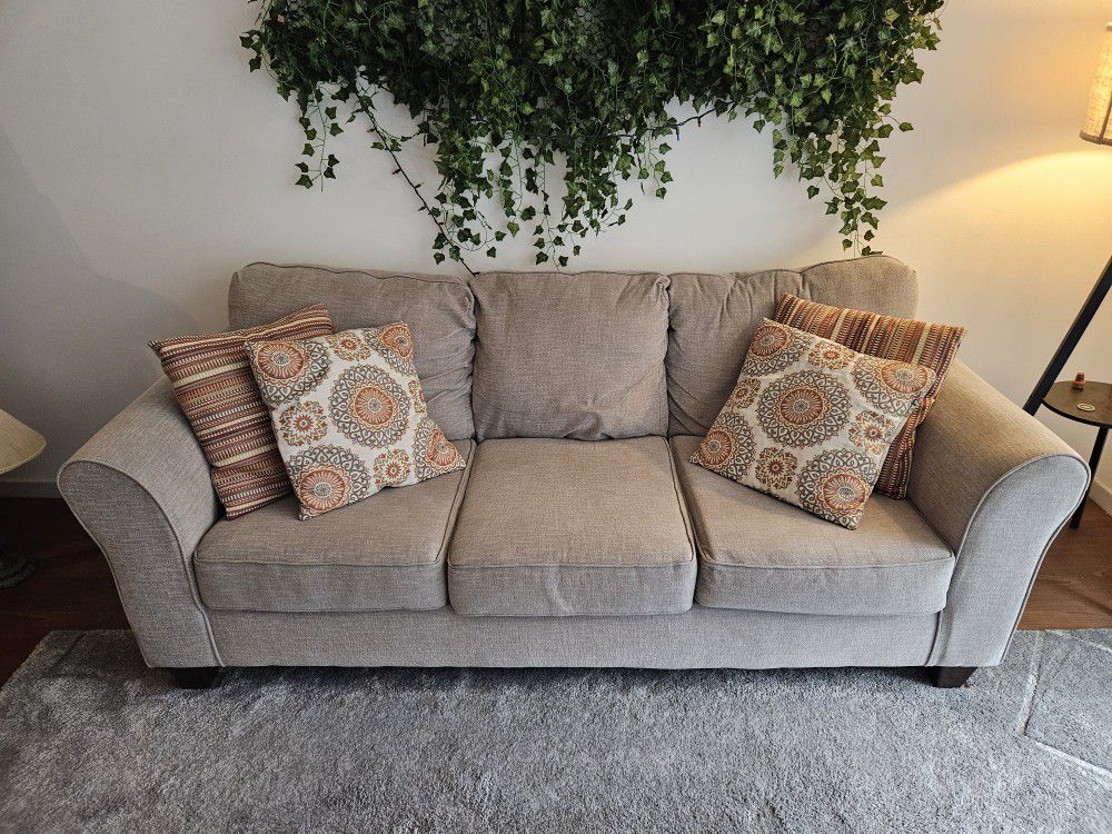 Grey Couch with Throw Pillows