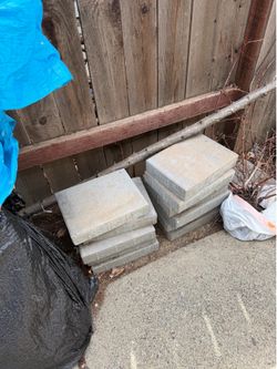 12 medium size concrete stones