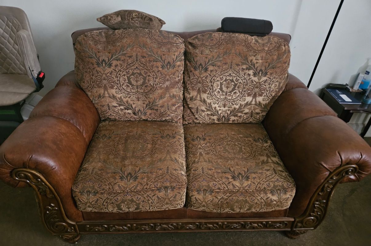 Leather loveseat, sofa, and wood table