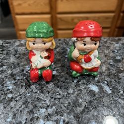 Vintage 1981 Avon Christmas Elf Pair of Salt and Pepper Shakers.  Size approximately 2 1/2 inches tall.  Preowned never used.  The bottom has stamped 