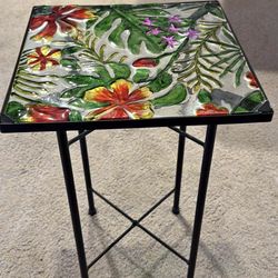 Beautiful metal black table with glass floral pattern