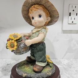 Montefiori Collectible Figurine- Young Boy With Sunflowers
