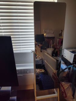 A long mirror that opens into a jewelry box