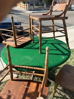 4 wooden chairs, one round wooden card table