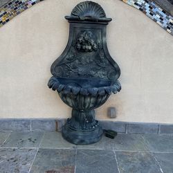 Antique-Style Wall Fountain with Cherub and Shell Motif