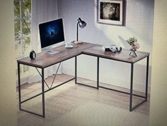 L shaped computer desk. Metal and wood corner desk. Oak top with black metal. 59/55”W x 19.7”D x 29.9” H. Brand new in box.