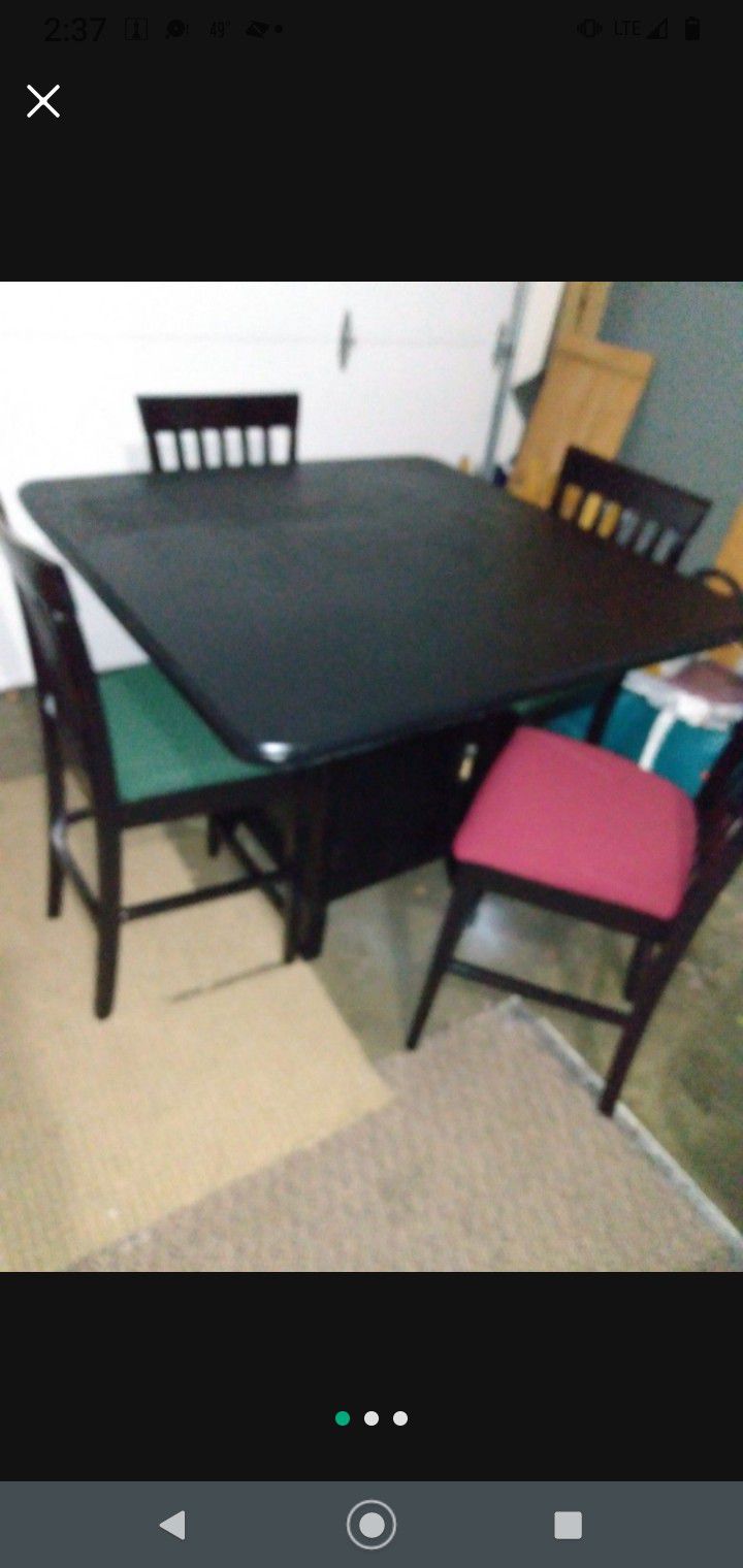 As a new freshly painted and upholstered tall dining set, table has bottom shelves and measures 46 "× 46" 37 "H and chairs 42" from back to floor and 