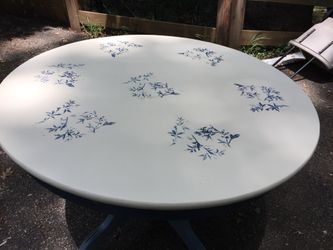 Chalk painted kitchen table . 43 inches in diameter and white top several coats of poly on for protection also in a 2 toned blue