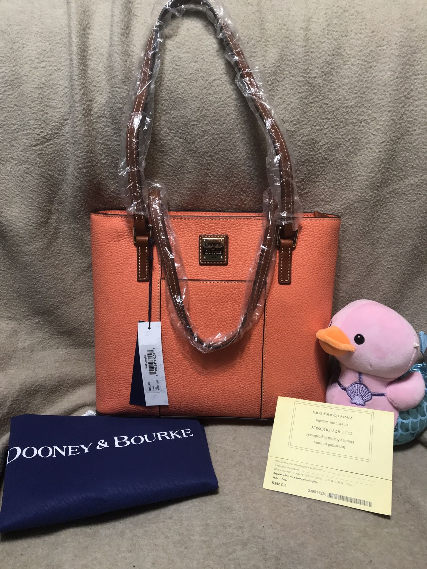 New With tags Dooney & Bourke Small Lexington Pebble Leather Tote, Color Coral With Matching Zip Around Wallet