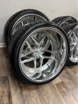 NEW staggered 22x9 and 22x12 polished wheels with tires