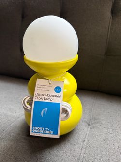Adorable Bright Yellow Room Essentials Rechargeable Battery-Operated Lamp Yellow Room Essentials table lamp is made of plastic and features a rechar