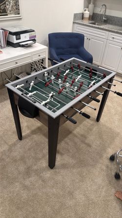 Foosball Table with Red and White Players