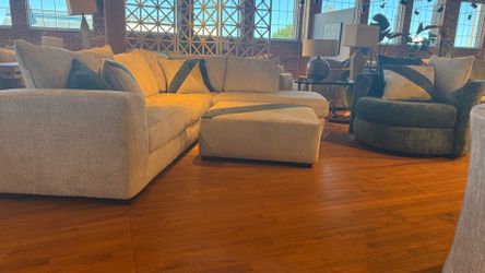 New sectional sofa with ottoman and swivel chair beige fabric.