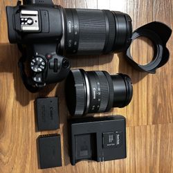 Canon R100 with 2 lenses, Extra batteries, Charger, Cleaning Tool