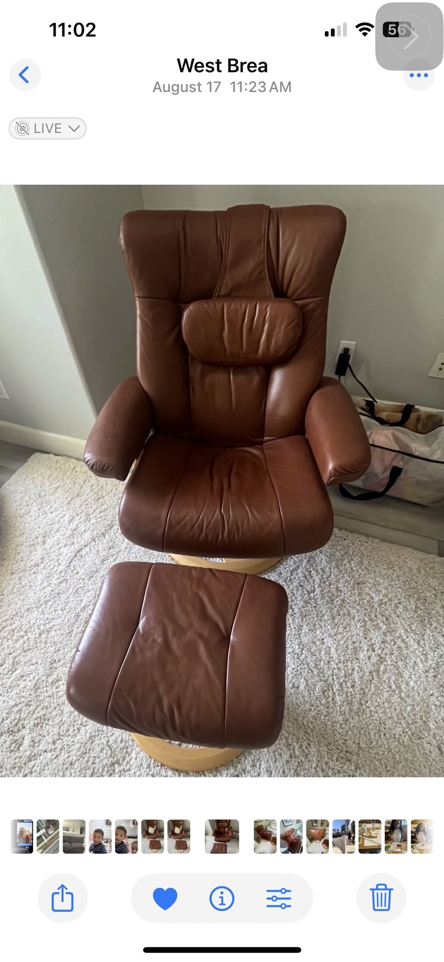 Hjellegjerde Mobler swivel recliner with a wooden base & ottoman.