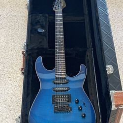 New-Beautiful blue 24 fret Fesley guitar w/ hard shell case.