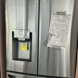 NEW IN BOX LG FRENCH STYLE STAINLESS STEEL REFRIGERATOR