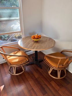 Round Bistro Table with Two Rattan Swivel Chairs