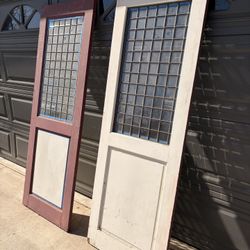 Ornate Wooden And Glass Doors.