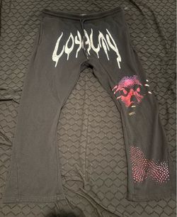 Black sweat pants with white lettering and purple graphic photo