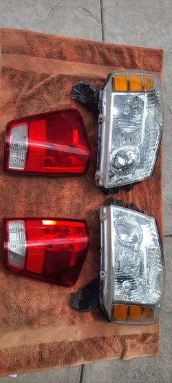 2004 - 2015 Nissan Titan OEM driver and passenger head lights and tail lights