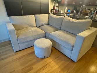 Luvsac Sactional with built in sound, recliner and hidden phone charging arms.